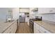 Modern kitchen with granite countertops and stainless steel appliances at 113 Corvus St, Summerville, SC 29483