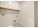 Laundry room with white cabinets and tile floor at 113 Corvus St, Summerville, SC 29483
