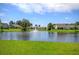 Serene pond with a water fountain and waterfront homes at 113 Corvus St, Summerville, SC 29483