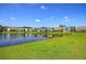 Beautiful pond view with houses and lush green grass at 113 Corvus St, Summerville, SC 29483