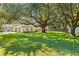 Large backyard with lush lawn and mature oak tree at 1475 Kinglet St, Mount Pleasant, SC 29464