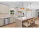 Bright kitchen features white cabinets, stainless steel appliances, and quartz countertops at 1475 Kinglet St, Mount Pleasant, SC 29464