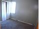 Bedroom with gray walls, carpet, and a built-in closet at 153 Davis Ter, Saint George, SC 29477