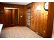 Wood paneled dining area with tile floor and built-in shelving at 153 Davis Ter, Saint George, SC 29477