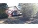 Brick and wood siding home with a screened porch at 153 Davis Ter, Saint George, SC 29477