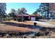 Brick ranch house with attached garage and mature landscaping at 153 Davis Ter, Saint George, SC 29477