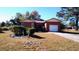 Brick ranch house with attached garage and mature landscaping at 153 Davis Ter, Saint George, SC 29477