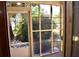 Enclosed porch with white door and view of backyard at 153 Davis Ter, Saint George, SC 29477