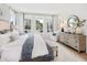 Bright bedroom featuring a king-size bed and large windows at 1695 Cultivation Lane St # 463, Mount Pleasant, SC 29466