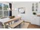 Charming dining room featuring a farmhouse table and bench at 1695 Cultivation Lane St # 463, Mount Pleasant, SC 29466