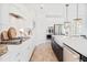 Modern kitchen with white cabinets, quartz countertops, and stainless steel appliances at 1695 Cultivation Lane St # 463, Mount Pleasant, SC 29466
