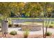 Brick fire pit with bench near a pond at 1726 Cultivation Ln # 534, Mount Pleasant, SC 29466