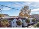 Aerial showing houses with light blue siding, palm trees, and a tree with yellow leaves at 195 Saint Philip St, Charleston, SC 29403