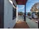 Private balcony with wood decking and glass railings offering city views at 195 Saint Philip St, Charleston, SC 29403