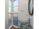 Small bathroom with glass sink and a decorative mirror at 195 Saint Philip St, Charleston, SC 29403