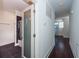 Bathroom hallway with dark floors and frosted glass door at 195 Saint Philip St, Charleston, SC 29403