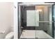 Bathroom with shower/tub combo and dark tile floors at 195 Saint Philip St, Charleston, SC 29403