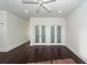Bright bedroom with hardwood floors and three frosted glass closet doors at 195 Saint Philip St, Charleston, SC 29403