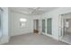 Charming bedroom with hardwood floors, two closets, and a ceiling fan at 195 Saint Philip St, Charleston, SC 29403