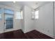 Bright bedroom with dark hardwood floors and multiple windows at 195 Saint Philip St, Charleston, SC 29403