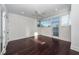 Bright bedroom with dark hardwood floors and access to a balcony at 195 Saint Philip St, Charleston, SC 29403