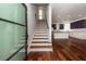 Modern entryway with hardwood floors and staircase to upper levels at 195 Saint Philip St, Charleston, SC 29403