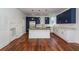 Modern kitchen with white and blue cabinets and a large island at 195 Saint Philip St, Charleston, SC 29403