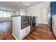 Modern kitchen with stainless steel appliances and hardwood floors at 195 Saint Philip St, Charleston, SC 29403