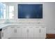 White kitchen cabinets and blue upper cabinets at 195 Saint Philip St, Charleston, SC 29403