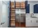 Modern kitchen with blue cabinets and ample pantry space at 195 Saint Philip St, Charleston, SC 29403