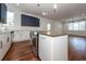 Open concept kitchen with island, stainless steel appliances, and hardwood floors at 195 Saint Philip St, Charleston, SC 29403