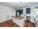 Modern kitchen with island, stainless steel appliances and blue cabinets at 195 Saint Philip St, Charleston, SC 29403