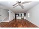 Open concept living room with kitchen and staircase at 195 Saint Philip St, Charleston, SC 29403