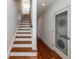 Modern staircase with hardwood treads and white risers at 195 Saint Philip St, Charleston, SC 29403