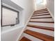 Modern staircase with hardwood treads and white risers at 195 Saint Philip St, Charleston, SC 29403