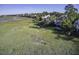 Houses along marsh with golf course in the distance at 32 Marsh Island (4 Shares) Ln, Isle of Palms, SC 29451
