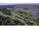 High-angle view showcasing golf course, marsh, and houses at 32 Marsh Island (4 Shares) Ln, Isle of Palms, SC 29451
