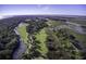 Drone view of upscale community near golf course and waterway at 32 Marsh Island (4 Shares) Ln, Isle of Palms, SC 29451