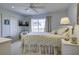 Bedroom with a queen bed, TV, and water views at 32 Marsh Island (4 Shares) Ln, Isle of Palms, SC 29451