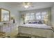 Bright bedroom with a queen-size bed and calming decor at 32 Marsh Island (4 Shares) Ln, Isle of Palms, SC 29451