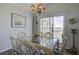 Dining area with glass-top table and chairs, overlooking marsh views at 32 Marsh Island (4 Shares) Ln, Isle of Palms, SC 29451