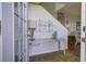 Bright entryway with tiled floor, console table, and view into living area at 32 Marsh Island (4 Shares) Ln, Isle of Palms, SC 29451
