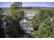Gray two-story house with attached garage and marsh views at 32 Marsh Island (4 Shares) Ln, Isle of Palms, SC 29451