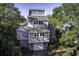 Gray two-story house with attached garage at 32 Marsh Island (4 Shares) Ln, Isle of Palms, SC 29451