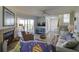 Living room with fireplace, hardwood floors, and access to deck at 32 Marsh Island (4 Shares) Ln, Isle of Palms, SC 29451