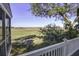 Enjoy serene marsh views from this home's deck at 32 Marsh Island (4 Shares) Ln, Isle of Palms, SC 29451