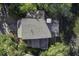 Aerial view of house showing gray roof and deck at 32 Marsh Island (4 Shares) Ln, Isle of Palms, SC 29451