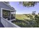 Screened porch with marsh views and outdoor dining set at 32 Marsh Island (4 Shares) Ln, Isle of Palms, SC 29451