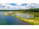 Aerial view of a serene lake with lush greenery along the shoreline at 409 True North Trl, Summerville, SC 29486