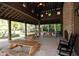 Covered pavilion with picnic tables, fireplace, and rocking chairs at 4135 Collins Dr, Charleston, SC 29414